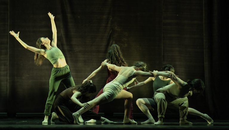 A group of contemporary dancers on stage