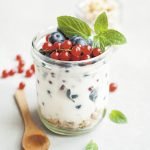 Yogurt with berries and mint on top